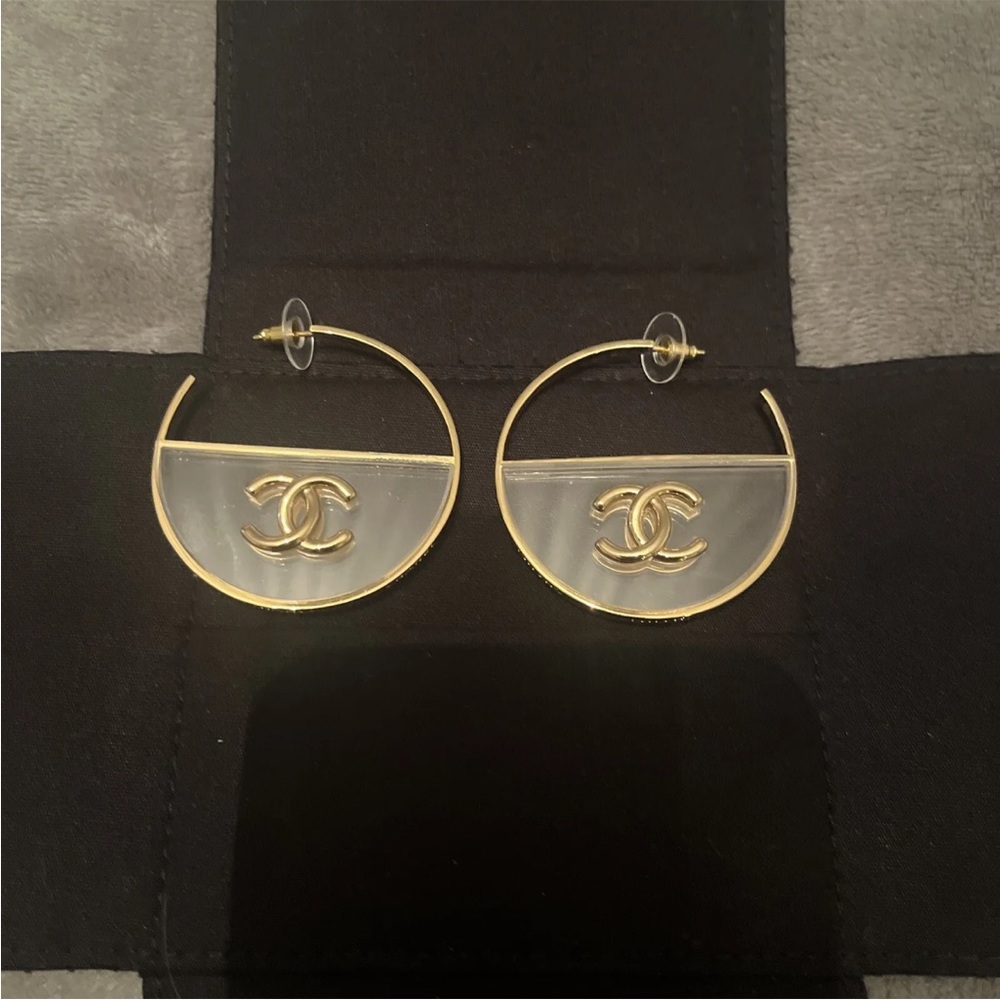 Chanel gold tone hoop earrings. Metal and clear plastic. No box